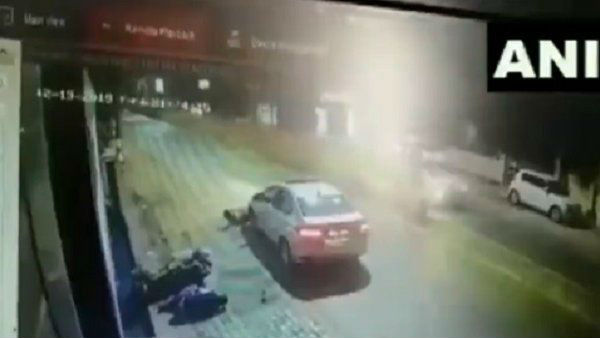 WATCH: Two bike-borne men were hit by a car after which one of them was dragged by it on road in Raipur. WATCH: Two bike-borne men were hit by a car after which one of them was dragged by it on road in Raipur.