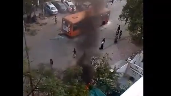 Visuals protesters setting a DTC bus on fire jamia citizenship amendment act violence Visuals protesters setting a DTC bus on fire jamia citizenship amendment act violence