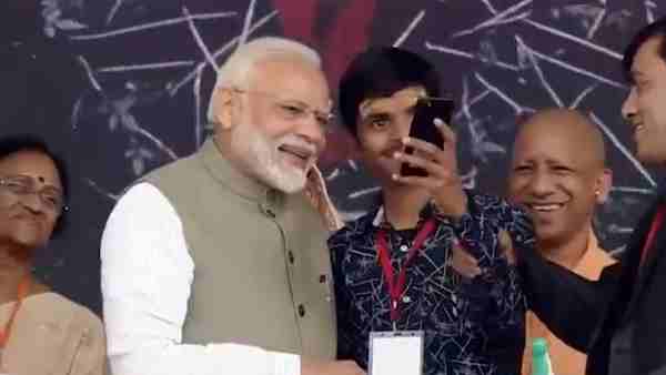 A visually-challenged vivek takes selfie with Prime Minister Narendra Modi on the smartphone A visually-challenged vivek takes selfie with Prime Minister Narendra Modi on the smartphone