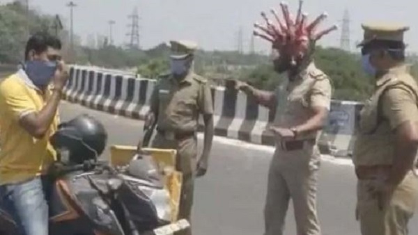 Chennai cop wears Corona like helmet in a bid to spread awareness, video goes viral Chennai cop wears Corona like helmet in a bid to spread awareness, video goes viral