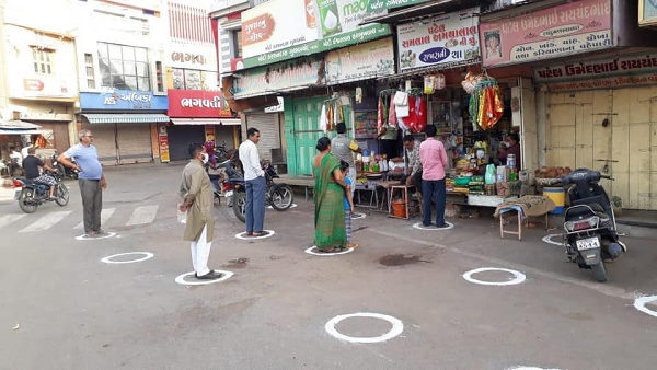 Watch: social-distancing on a Gujarati store, drew boxes for customers to standing, Video Watch: social-distancing on a Gujarati store, drew boxes for customers to standing, Video