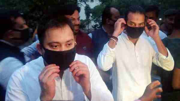 Tej Pratap also gave mask and hand sanitizer to Tejashwi Yadav Tej Pratap also gave mask and hand sanitizer to Tejashwi Yadav