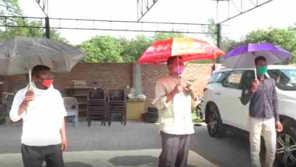 bjp mla rajesh mishra social distancing through umbrella bjp mla rajesh mishra social distancing through umbrella