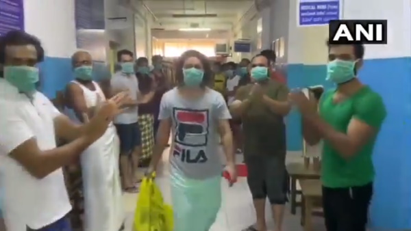 Kerala Medical staff patients claps COVID 19 patient leaves hospital after being cured of disease Kerala Medical staff patients claps COVID 19 patient leaves hospital after being cured of disease