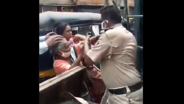 lockdown: scuffle between a hawker and police personnel in Mumbai lockdown: scuffle between a hawker and police personnel in Mumbai