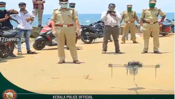 Kerala police chasing lockdown breakers with drone, people running Kerala police chasing lockdown breakers with drone, people running