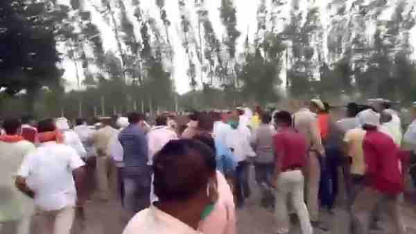 Angry villagers chase BJP MLA Baba Gorakhnath in sugarcane field Angry villagers chase BJP MLA Baba Gorakhnath in sugarcane field