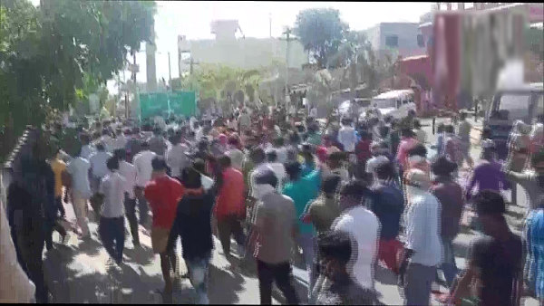 crowd of Migrant workers staged protest at Hazira industrial area in Surat, 55-60 were arrested by Police crowd of Migrant workers staged protest at Hazira industrial area in Surat, 55-60 were arrested by Police