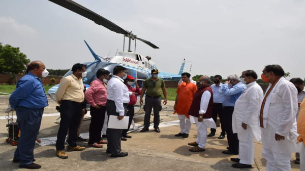 Medicine will be sprayed on Locusts by a helicopter Medicine will be sprayed on Locusts by a helicopter