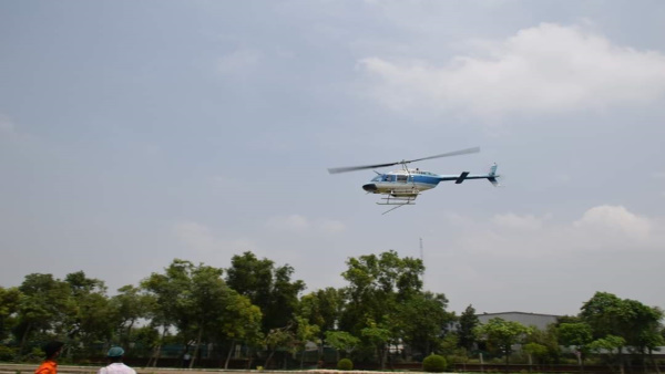 Medicine will be sprayed on Locusts by a helicopter Medicine will be sprayed on Locusts by a helicopter