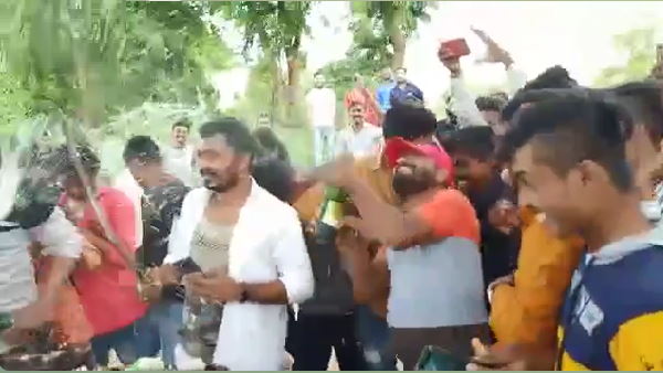 BJP Youth Front leader cuts cake with sword, celebrates with beer BJP Youth Front leader cuts cake with sword, celebrates with beer