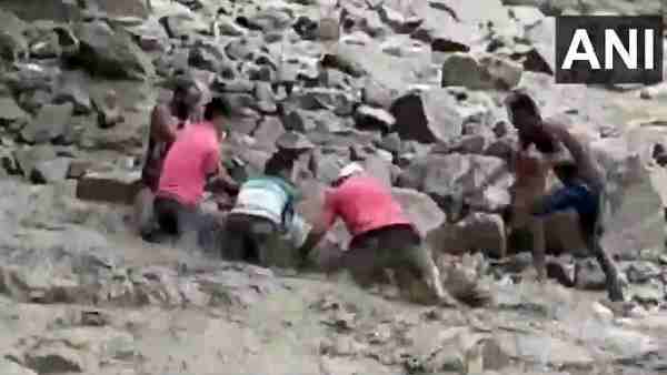 Congress MLA Harish Dhami had a narrow escape after he slipped while crossing a flooded rivulet in Dharchula Congress MLA Harish Dhami had a narrow escape after he slipped while crossing a flooded rivulet in Dharchula