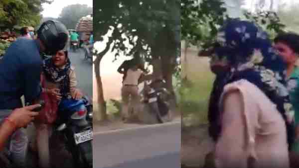 a woman police constable was beaten up on the middle road by Husband in Budaun district a woman police constable was beaten up on the middle road by Husband in Budaun district