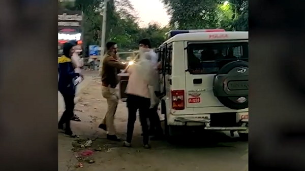 Male policeman slaps a young girl at ahmedabad, video goes to viral Male policeman slaps a young girl at ahmedabad, video goes to viral