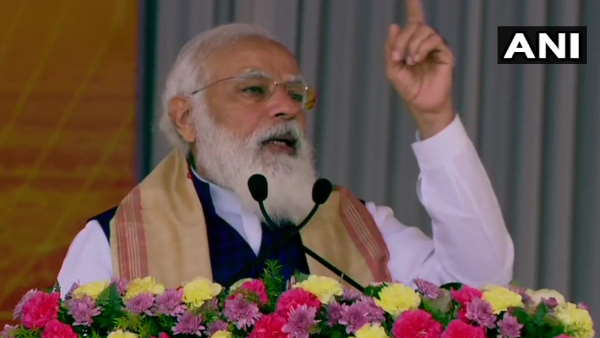 PM narendra modi in Sivasagar Assam distributes land allotment certificates to indigenous people PM narendra modi in Sivasagar Assam distributes land allotment certificates to indigenous people