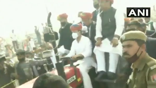 Congress leader Rahul Gandhi drives a tractor in Roopangarh, Rajasthan Congress leader Rahul Gandhi drives a tractor in Roopangarh, Rajasthan