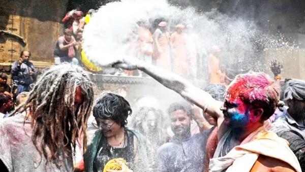 Holi festival celebrated with ashes and gulal at Manikarnika Ghat in Varanasi Holi festival celebrated with ashes and gulal at Manikarnika Ghat in Varanasi