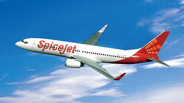 Passenger tries to open emergency door mid flight handed over to police in Varanasi Passenger tries to open emergency door mid flight handed over to police in Varanasi