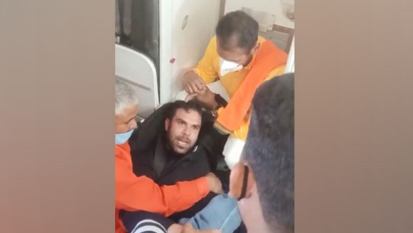 Passenger tries to open emergency door mid flight handed over to police in Varanasi Passenger tries to open emergency door mid flight handed over to police in Varanasi