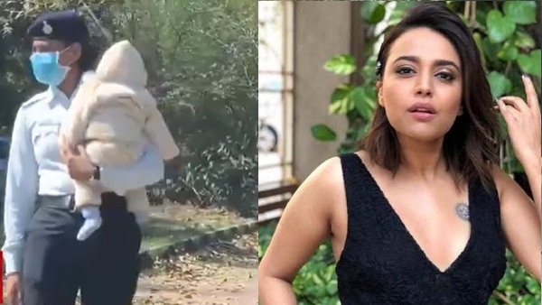 गोद में बच्चा लिए ट्रैफिक संभाला