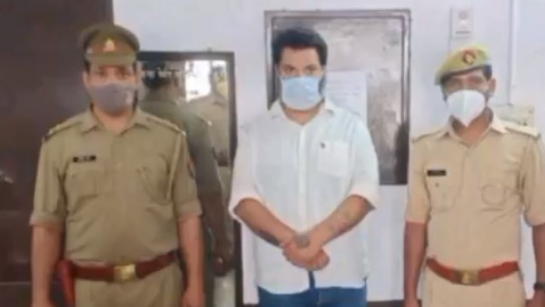 man handcuffed by police for black marketing of Remdesivir injections in noida man handcuffed by police for black marketing of Remdesivir injections in noida
