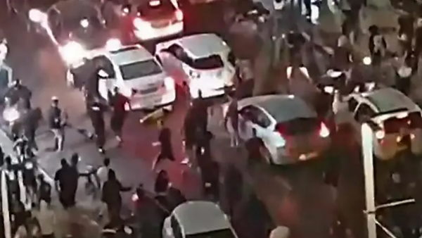 Footage of a far right Israeli mob attacking a man near Tel Aviv they believed to be an Arab Footage of a far right Israeli mob attacking a man near Tel Aviv they believed to be an Arab