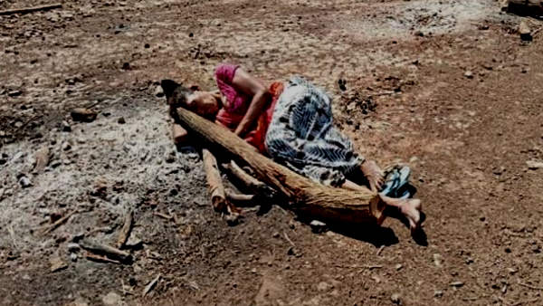 mother Manguben Chauhan lies on ashes of sons pyre in Banaskantha Gujarat mother Manguben Chauhan lies on ashes of sons pyre in Banaskantha Gujarat
