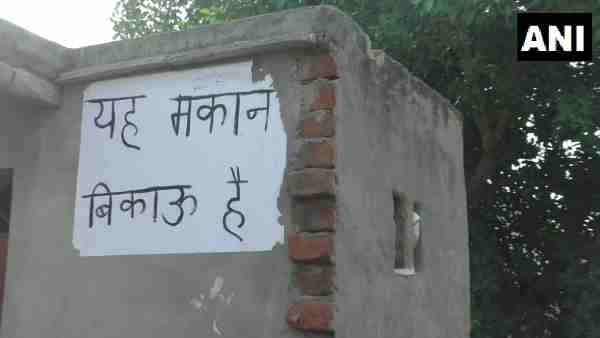 Hapur: Adarsh Nagar colony residents put up house on sale posters outside houses Hapur: Adarsh Nagar colony residents put up house on sale posters outside houses
