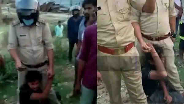 Three policemen suspended for beating young man Three policemen suspended for beating young man