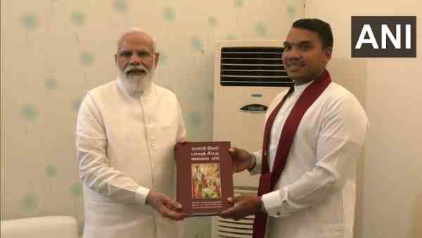 Sri Lankas Cabinet Minister Namal Rajapaksa gift a Bhagavad Gita to PM Narendra Modi Sri Lankas Cabinet Minister Namal Rajapaksa gift a Bhagavad Gita to PM Narendra Modi