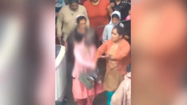 Delhi woman sexually assaulted hair cut and face painted black paraded by neighbours watch video Delhi woman sexually assaulted hair cut and face painted black paraded by neighbours watch video