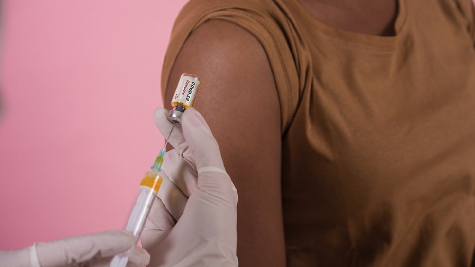 African-American woman getting a Covid vaccine African-American woman getting a Covid vaccine