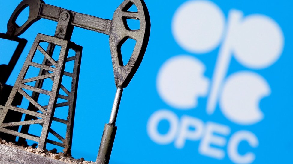 A 3D-printed oil pump jack is seen in front of the Opec logo (14 April 2020) A 3D-printed oil pump jack is seen in front of the Opec logo (14 April 2020)