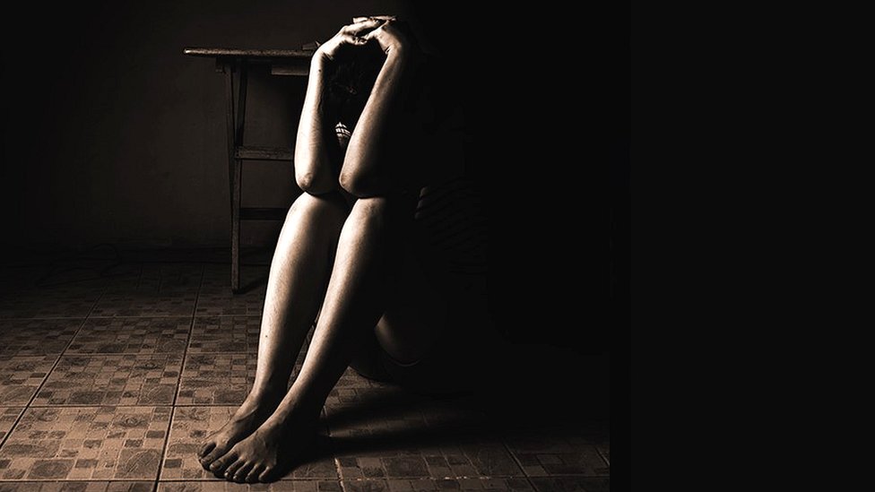 Woman sat on a floor Woman sat on a floor
